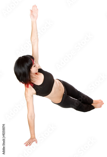 Young woman doing floor exercise, studio shut