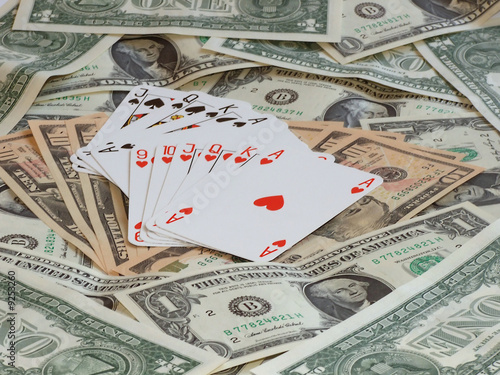 hearts poker and poker game against background made of dollars