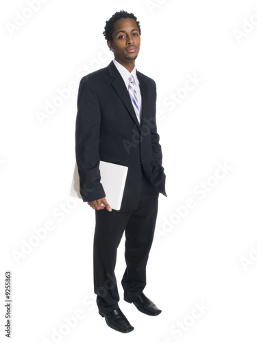 businessman holding a laptop computer.