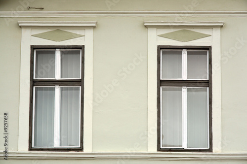 two romanian classic windows on painted wall