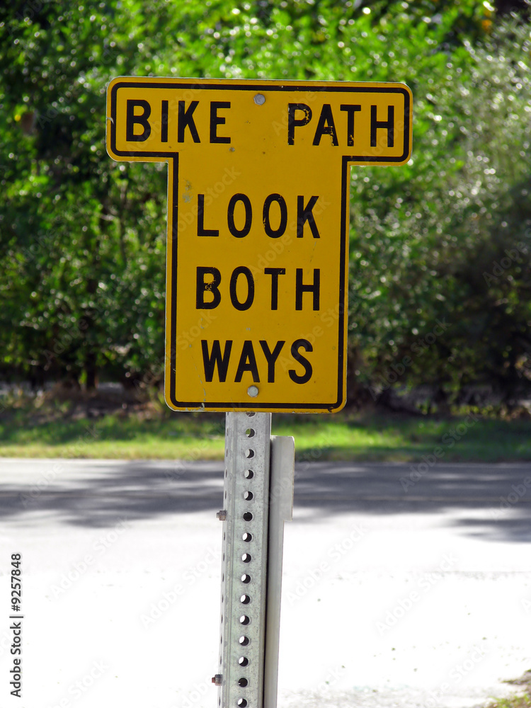 a bike path sign look both ways