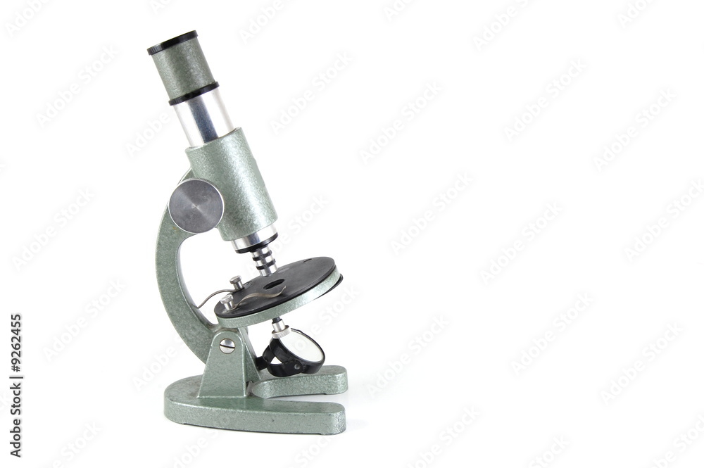 Old microscope isolated on a white background Old microscope isolated on a white background