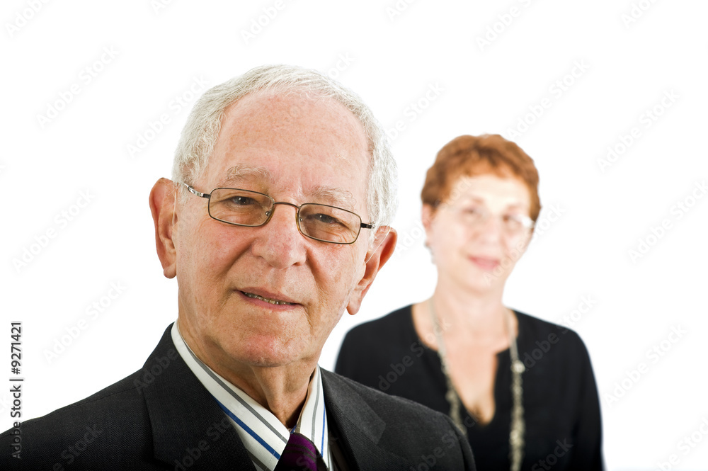 closeup portrait off a senior businessman with colleague closeup portrait off a senior businessman with colleague