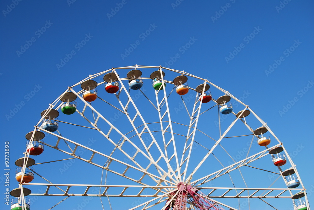 Ferris wheel on background blue sky Ferris wheel on background blue sky