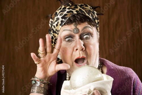 Female gypsy fortune teller with a crystal ball