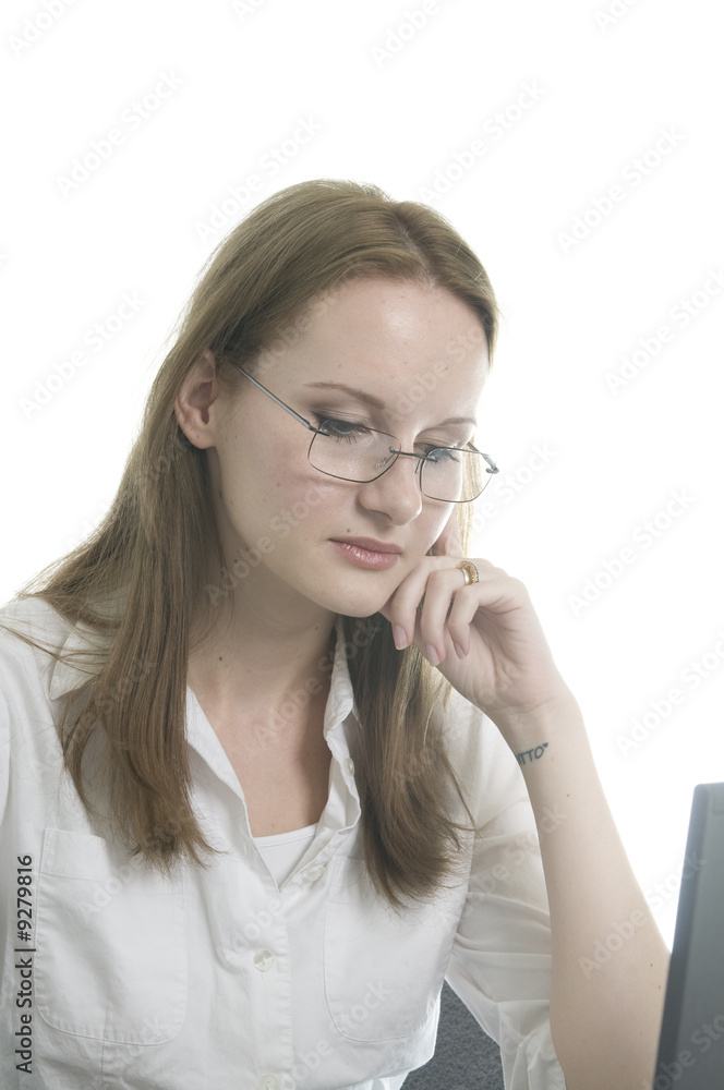 brunette working at various tasks in her office