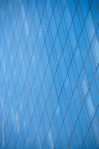 Close up of office building windows with blue glass