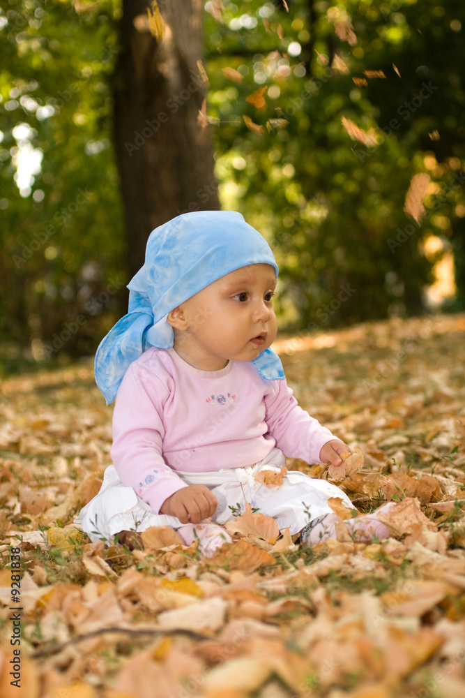 Little baby sitting comfort in park. Little baby sitting comfort in park.