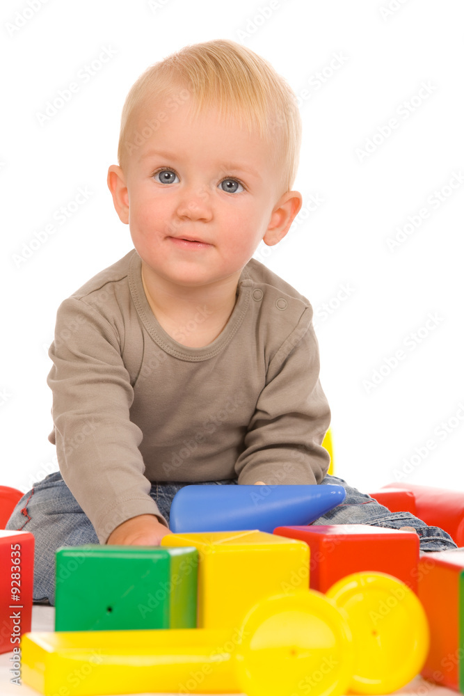 little boy play with bricks. isolated on a white background little boy play with bricks. isolated on a white background
