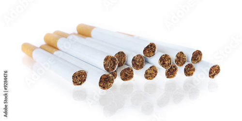Stack of cigarettes isolated on white with reflection