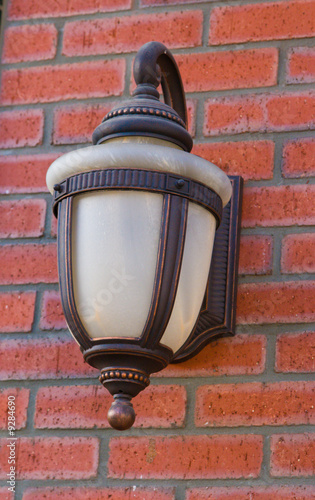 Street lamp on a brick wall