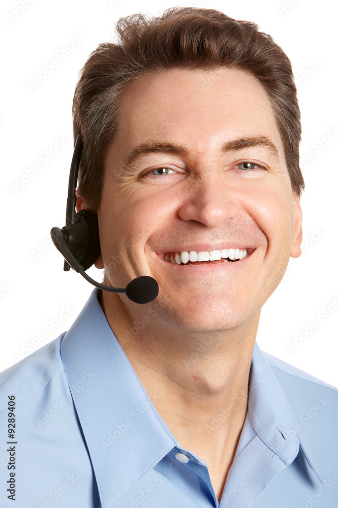 Smiling businessman with headset. Over white background . Smiling businessman with headset. Over white background .