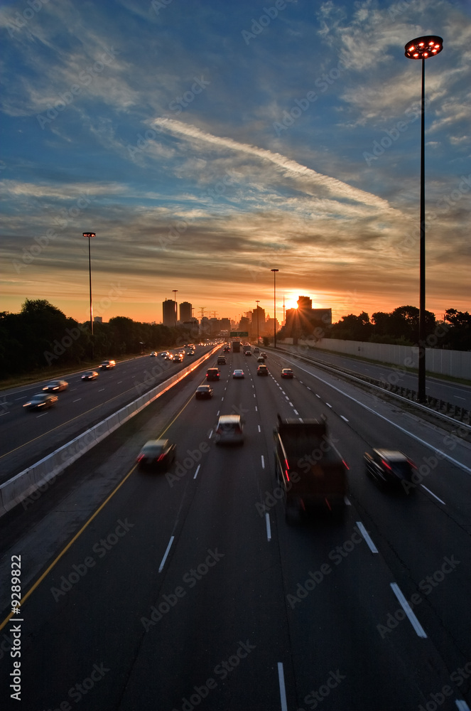 Cars on the highway at the beginning of morning rush hour