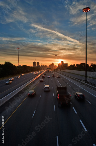 Cars on the highway at the beginning of morning rush hour