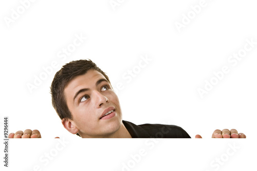 Handsome Young man, looking up with curious expression.