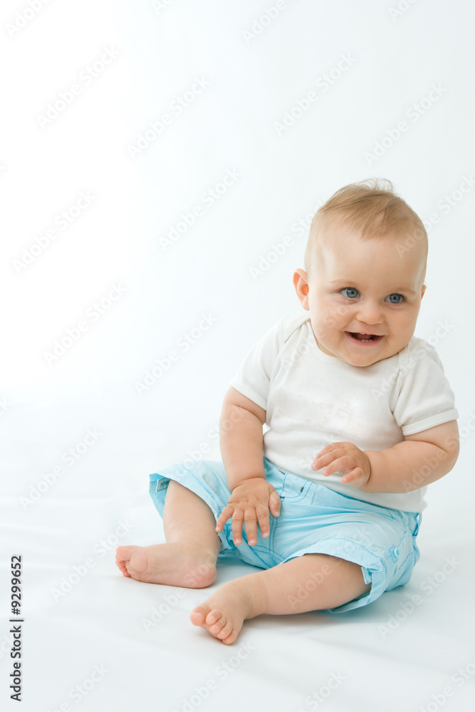 cute laughing baby boy sitting on white background cute laughing baby boy sitting on white background