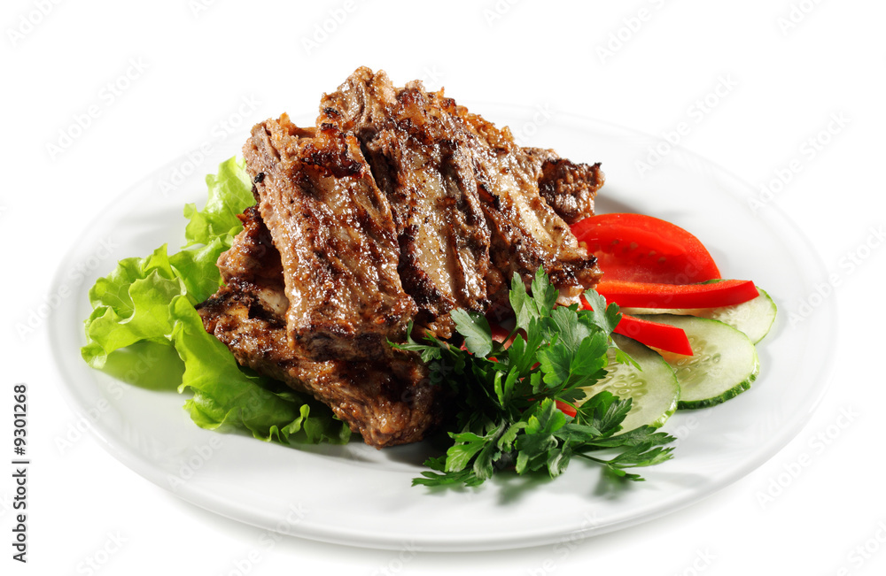 Beef (or Pork) Grilled with Greens and Vegetables on a Plate Beef (or Pork) Grilled with Greens and Vegetables on a Plate