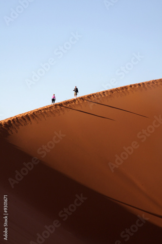 Climbing a desert dune - Namibia