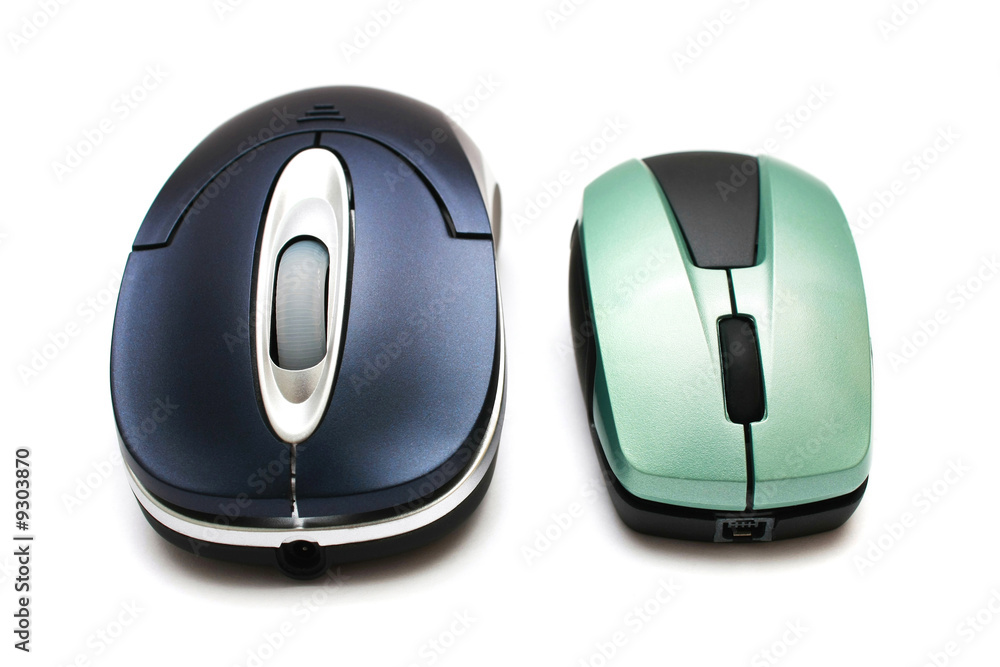 A big and small wireless mouse on white background. A big and small wireless mouse on white background.