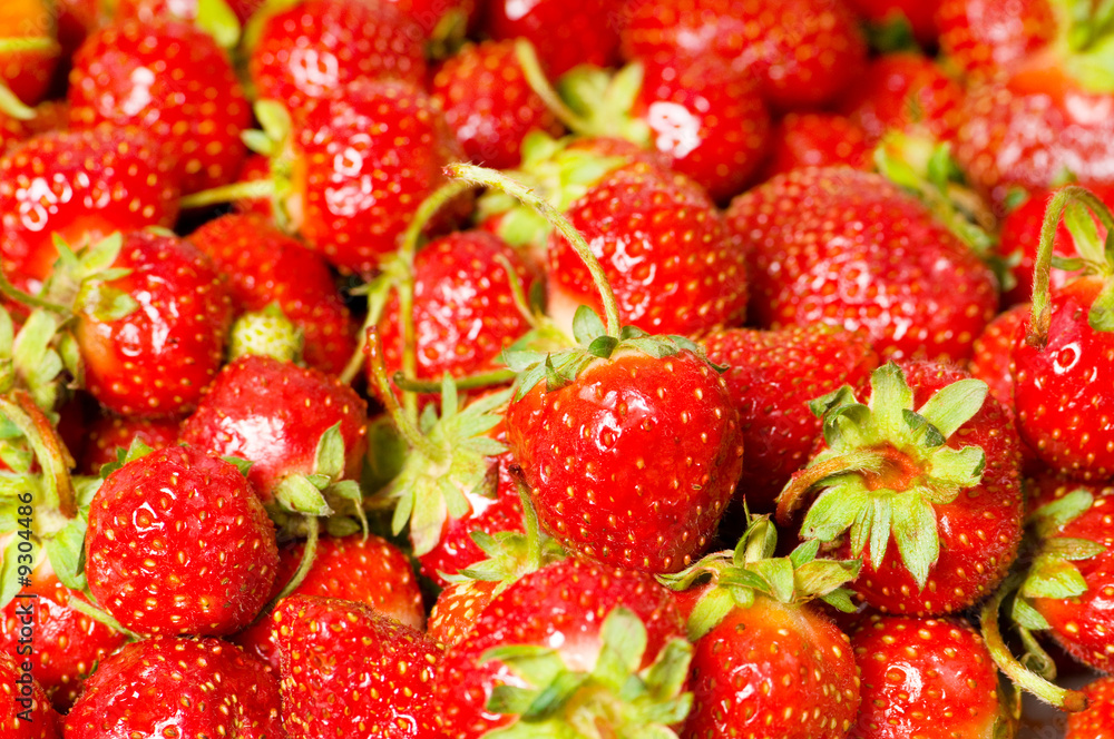 Fruit concept - red strawberries arranged as background Fruit concept - red strawberries arranged as background
