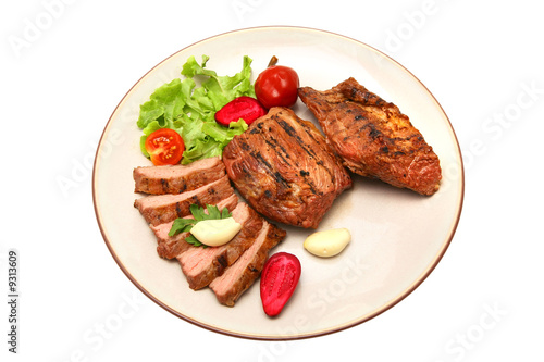 served roasted beef meat steak on color dish