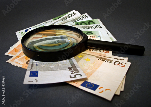 Money And Magnifying Glass photo