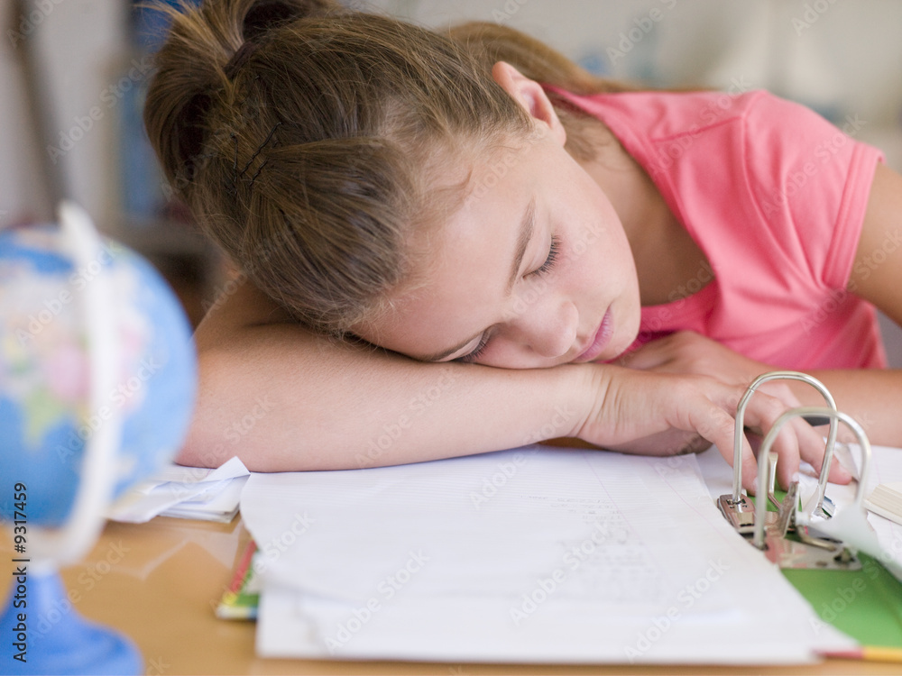 Young Girl Asleep On Her Homework Young Girl Asleep On Her Homework