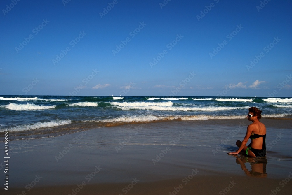 Woman on the beautiful beach of sea Woman on the beautiful beach of sea