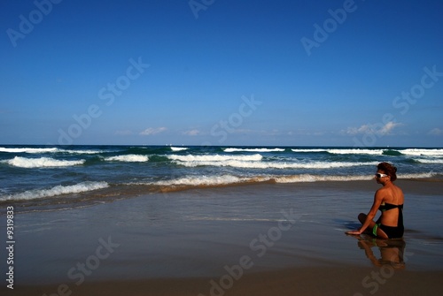 Woman on the beautiful beach of sea