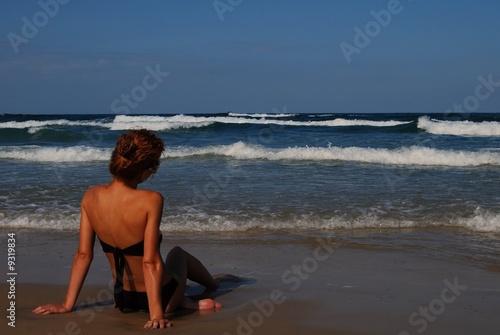 Woman on the beautiful beach of sea