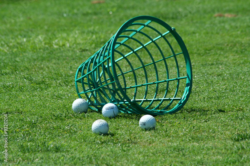 A Spilled bucket of practice golf balls
