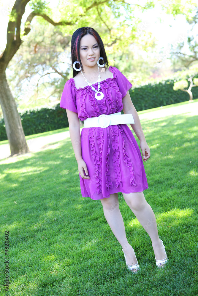 A young, pretty asian woman in the park
