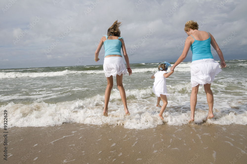 Happy family playing on the beach Happy family playing on the beach