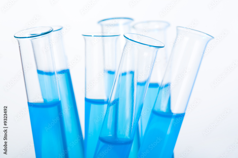 Image of several medical flasks with blue water Image of several medical flasks with blue water