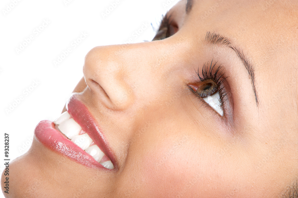 Naklejka premium Beautiful young woman smiling. Isolated over white background.