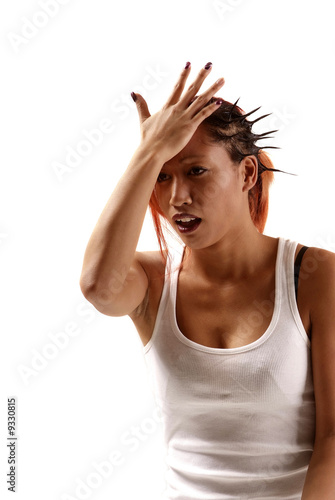 young woman touching her forehead with hand