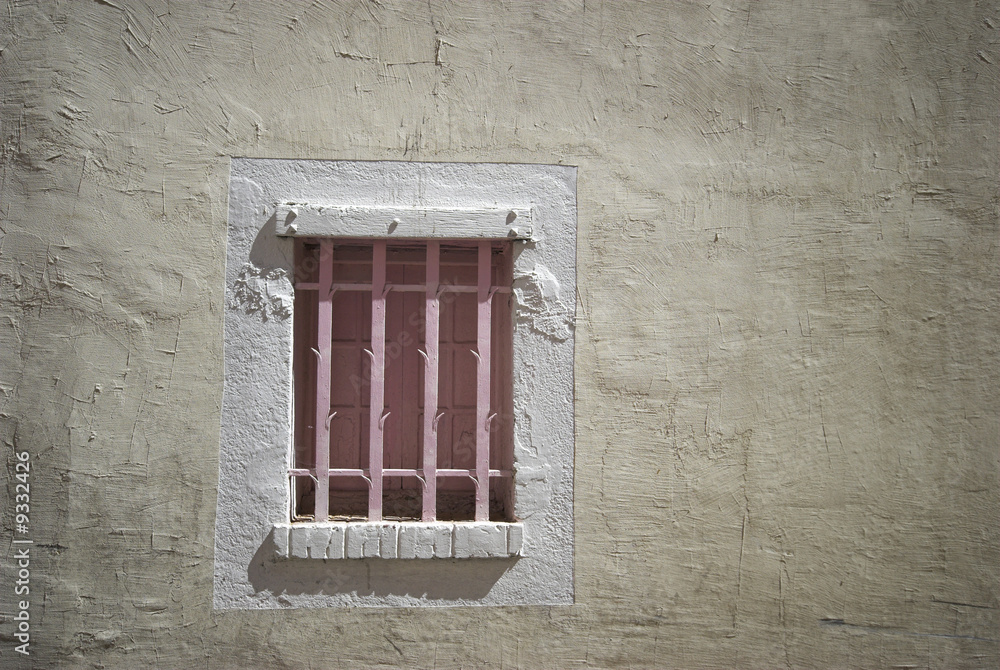 Old Window with Pink Bars..Building Exterior