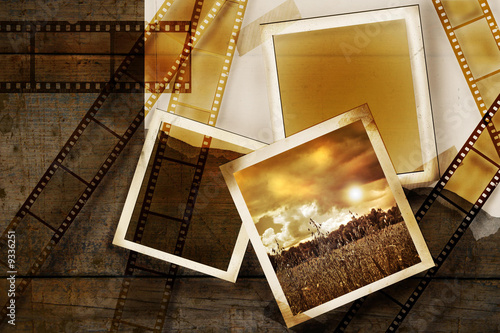 Old film and photos on distressed wood background