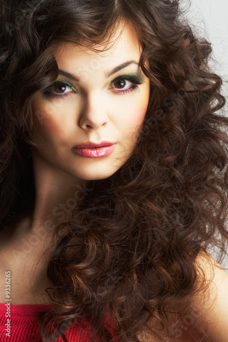 Portrait of sexy woman with beautiful make-up and curly hair
