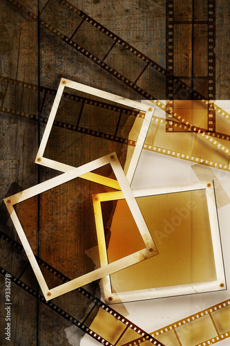Old film and photos on distressed wood background