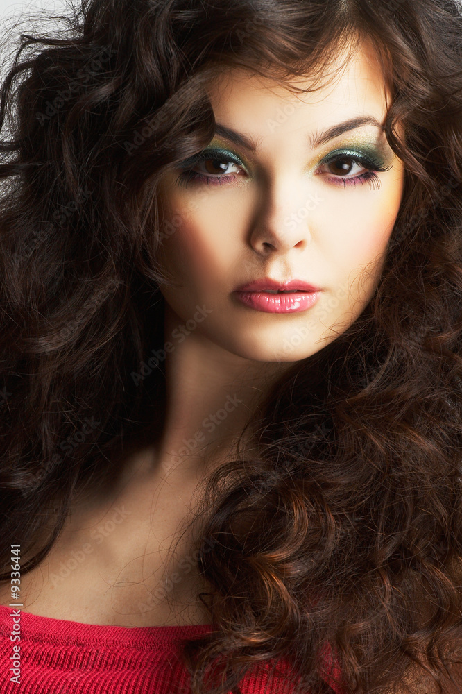 Fototapeta premium Portrait of sexy woman with beautiful make-up and curly hair