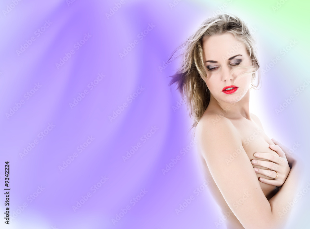 portrait of the nude blonde with blue eyes on white