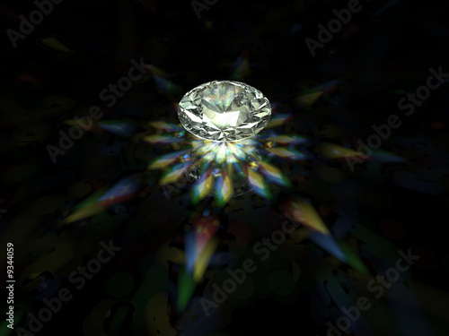 A sparkling brilliant cut diamond on dark background