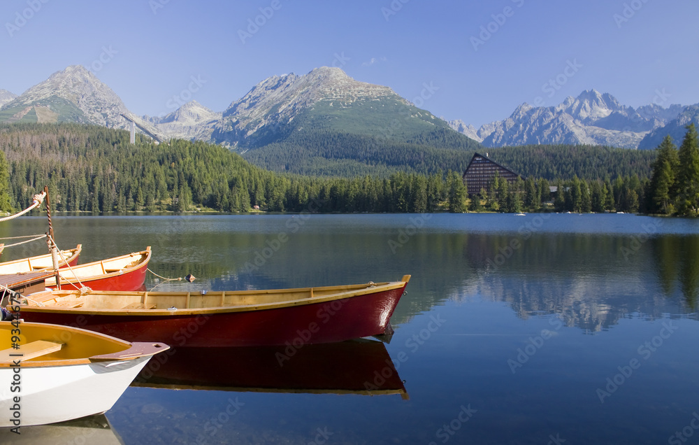 Mountain lake with  boats in National Park High Tatra, Slovakia