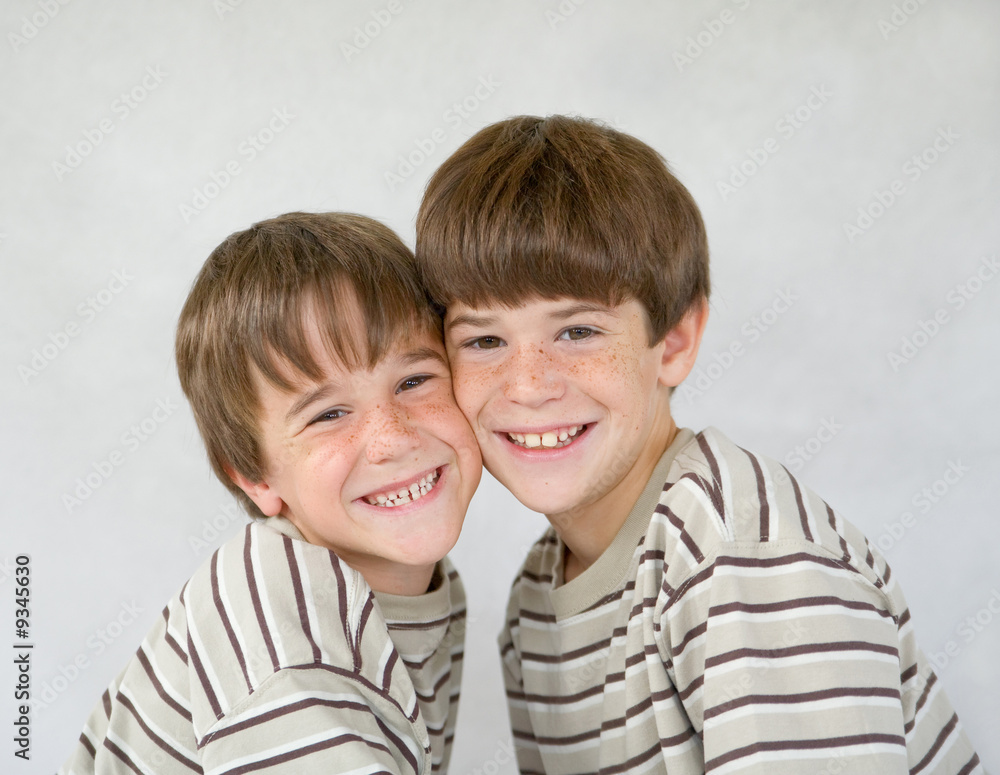 Brothers Against a White Background Brothers Against a White Background