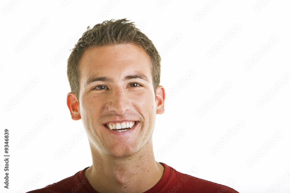 Obraz premium A young guy with a nice smile on a white background