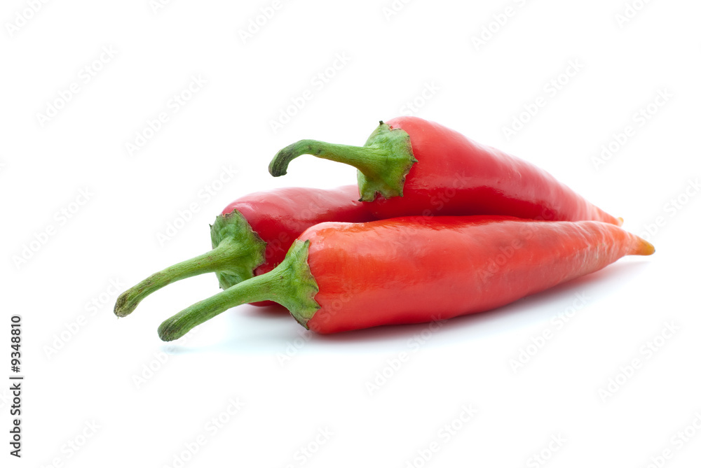 Three red hot peppers isolated on the white background