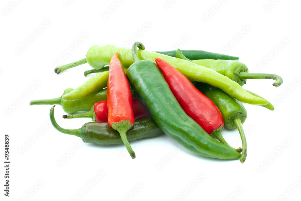 Pile of different hot peppers isolated on the white background