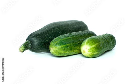 Cukini and pair of cucumbers isolated on the white background