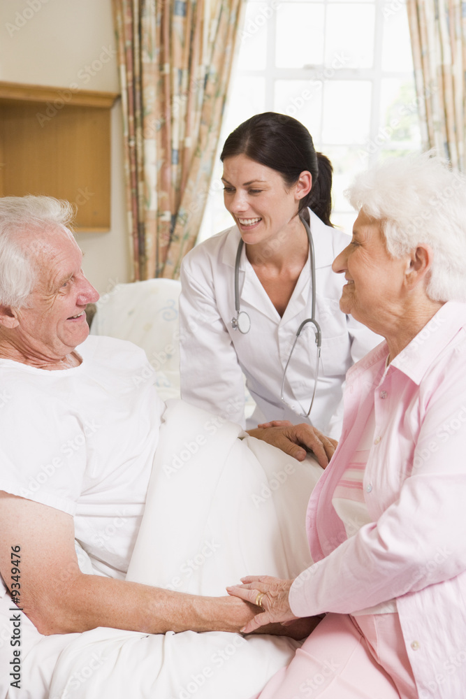 Doctor Talking To Senior Man And His Wife Doctor Talking To Senior Man And His Wife